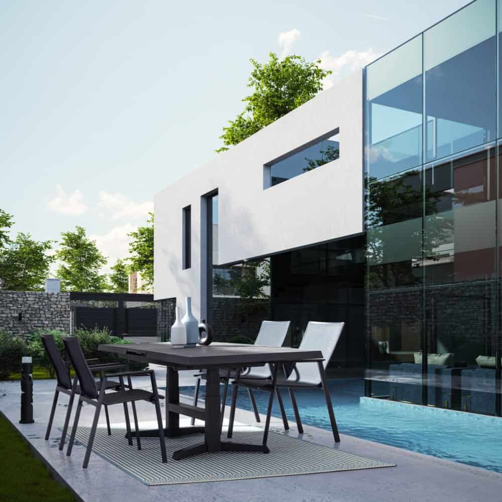 Ampia casa moderna con piscina e spazio esterno per relax e pasti all'aperto.