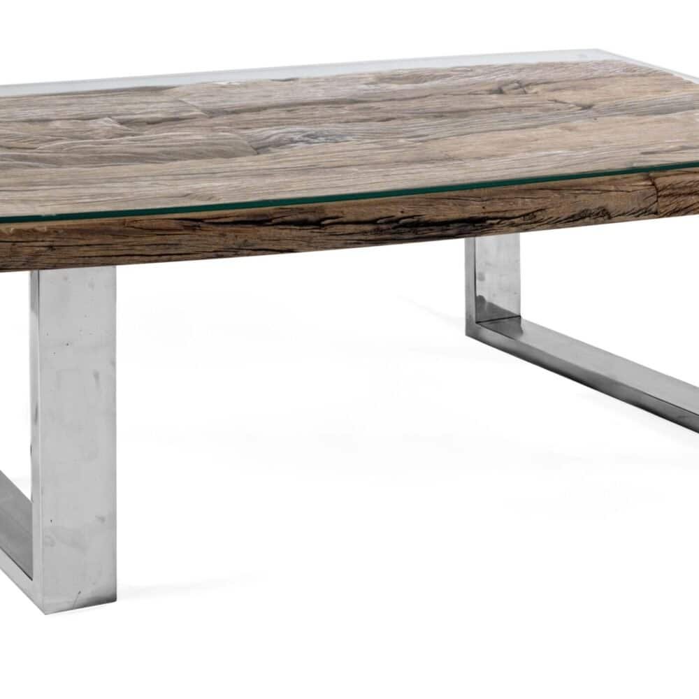 Descrizione di un tavolo in legno massiccio con piano in vetro e piedi in metallo lucido.