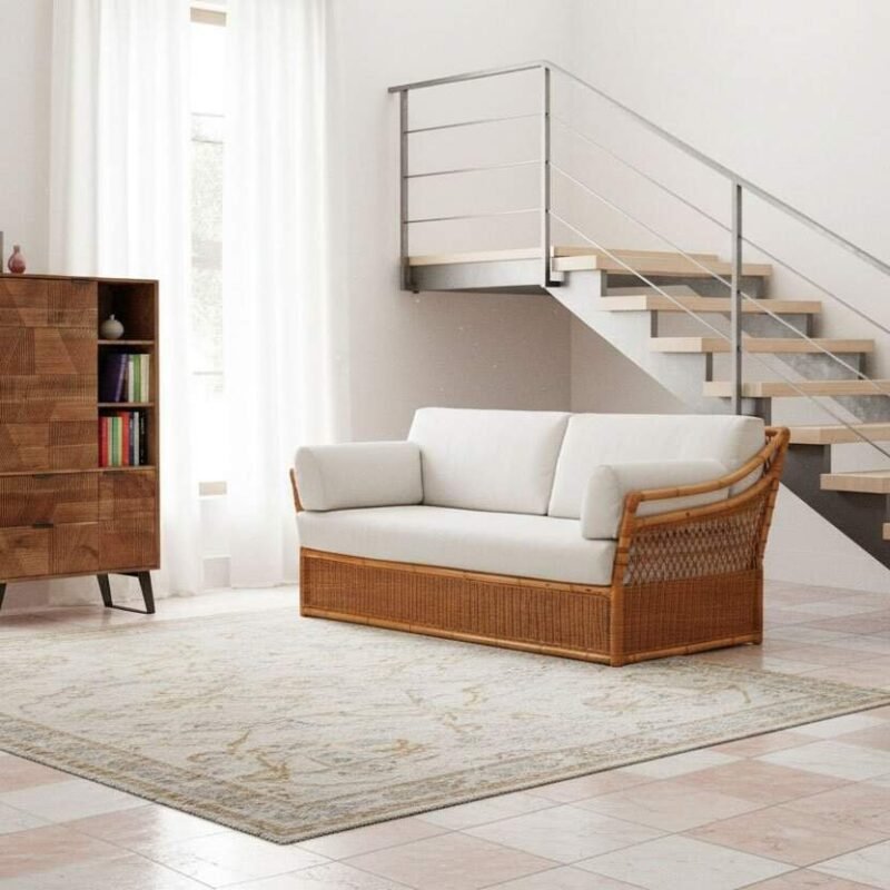 JOLLYGIUNCO - Salotto moderno con scala a vista - JOLLYGIUNCO Immagine di un salotto moderno con divano bianco, libreria in legno e scala a vista in ambiente lumi.