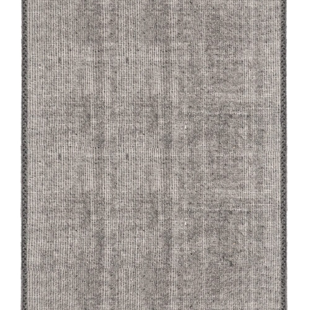 Tappeto grigio con raffinato design e dettagli artigianali. Perfetto per ambienti moderni e sofisticati.