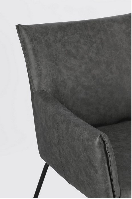 SEDIA C-BR EVELYN DARK6 - JOLLYGIUNCO Close-up of a dark gray upholstered armchair showing the backrest and armrest, with a black metal leg visible.