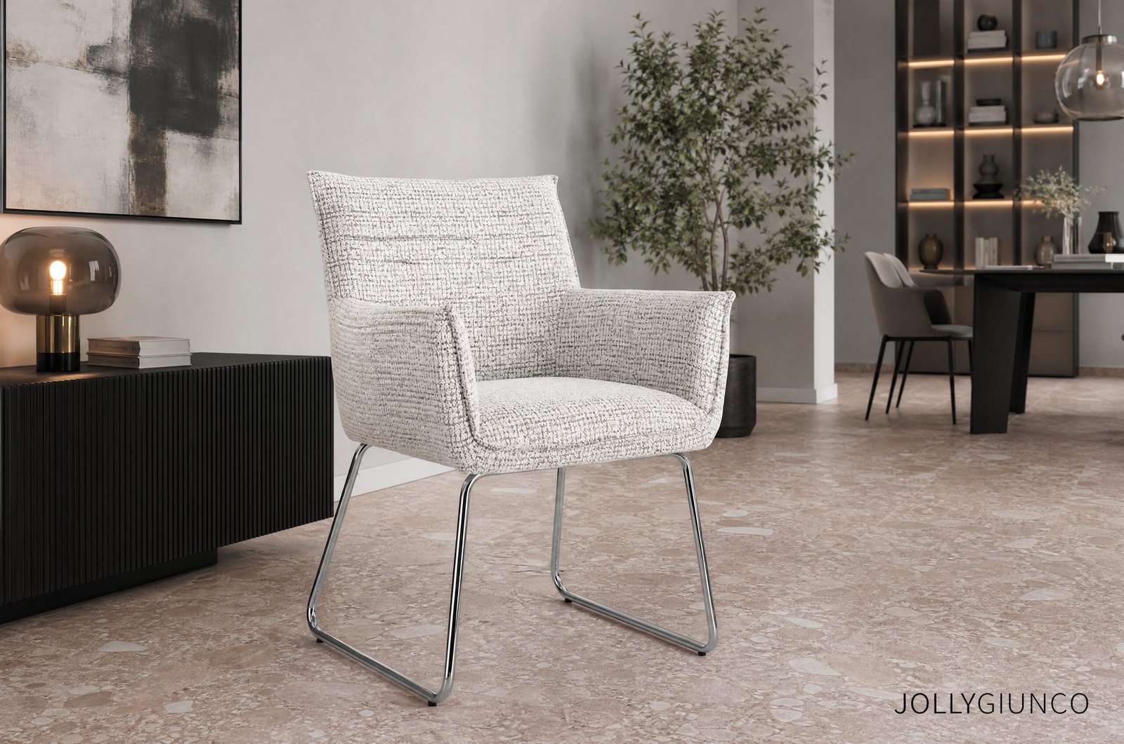 SEDIA C-BR EVELYN GHIACCIO90 - JOLLYGIUNCO Modern living room with a textured white chair, black ribbed console, abstract wall art, and a tall plant in the background.