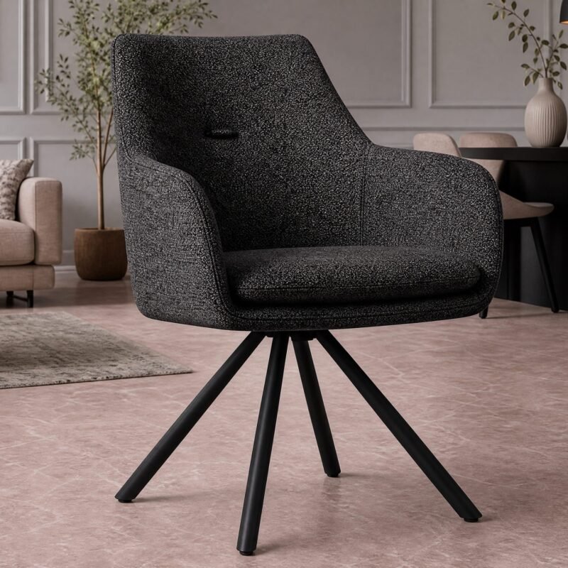 Dark, speckled fabric swivel chair on black legs dominates a modern living room with a beige sofa and dining area in the background.