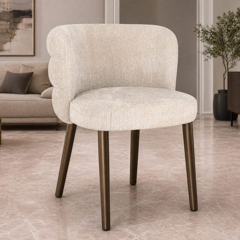 Beige upholstered armchair with dark wooden legs in a modern living room setting