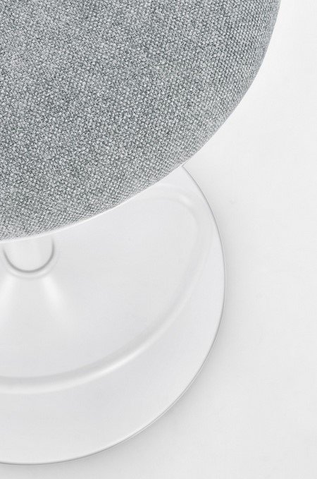 SGABELLO BAR LOWELL BIANCO6 - JOLLYGIUNCO Close-up of a gray, textured upholstered seat on a clear round pedestal base.