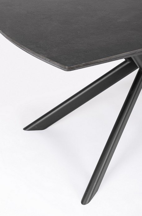 TAVOLO ALLJANIKA 160-240X90 NERO5 - JOLLYGIUNCO Close-up of a dark grey tabletop edge with black angled metal legs on a white background.
