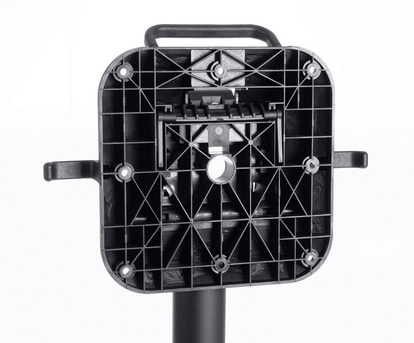 BASE TAVOLO ANNA NERO H728 - JOLLYGIUNCO Backside of a square black plastic mounting plate with a geometric grid pattern, central circular pivot, and a vertical pole below.