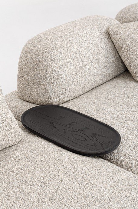 DIVANO 4+1P C-C ISIDE C-PENISOLA12 - JOLLYGIUNCO Oval black serving tray resting on a light beige fabric sofa cushion(s).