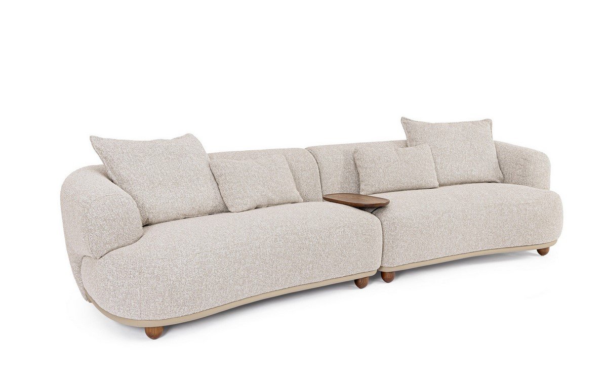 DIVANO 4P C-C CHEOPE - JOLLYGIUNCO Beige modular sectional sofa with rounded arms and matching cushions, featuring a small wooden tray table between sections.