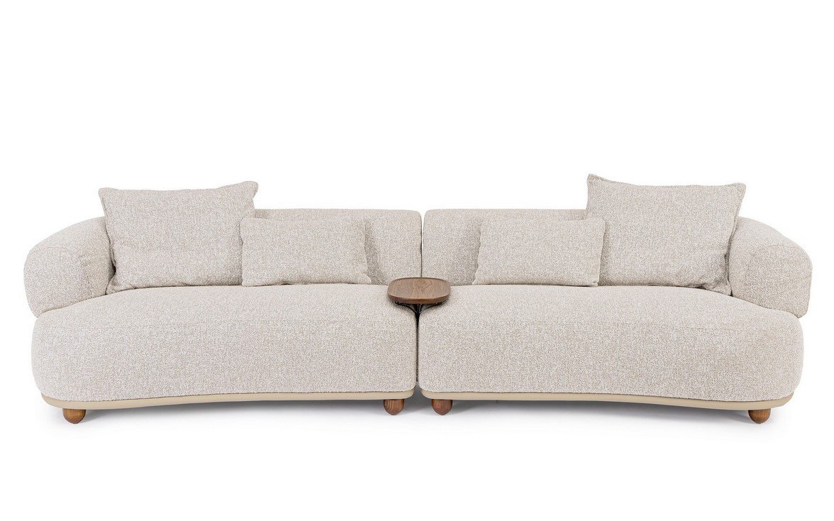 DIVANO 4P C-C CHEOPE1 - JOLLYGIUNCO Beige fabric sectional sofa with two connected sections, multiple back cushions, and a small wooden tray table between them.