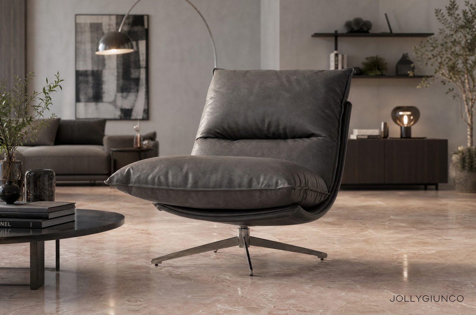 POLTRONA ALANEZ GRIGIO SCURO10 - JOLLYGIUNCO Modern living room with a large gray leather lounge chair, black coffee table, and plants in a neutral-toned space.
